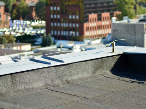 Commercial roofing inspection after a storm in Clayton, NC.