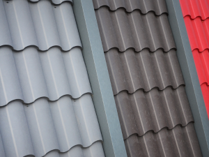 A Garner roofer showcasing samples of advanced roofing materials ideal for local weather conditions.