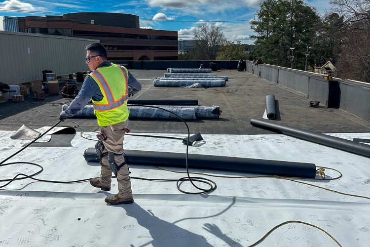 Raleigh NC commercial roofing contractor at work on an office building