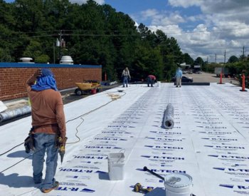 Roof replacement in progress at a Garner business
